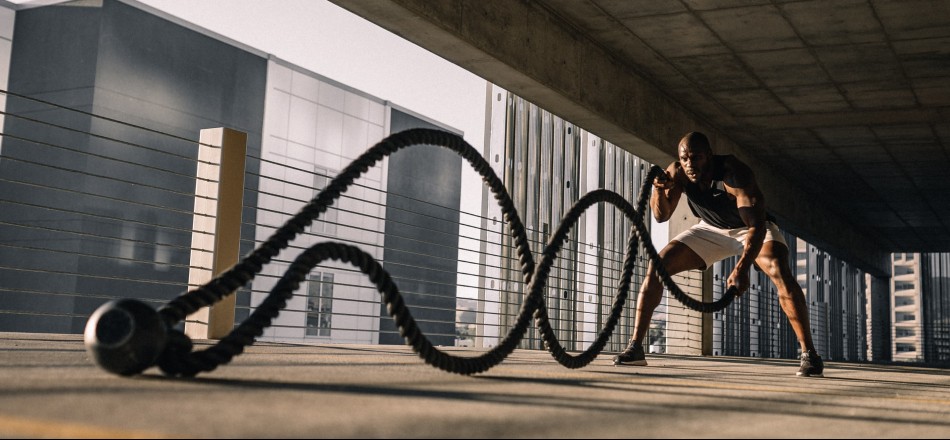 Black man working out with rope in an empty parking lot | Modafinil experience